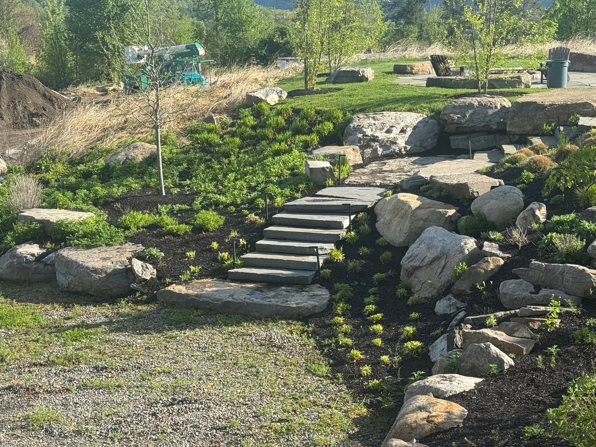 Boulder Walls, Bluestone Walkways and Layered Plantings Done Right image